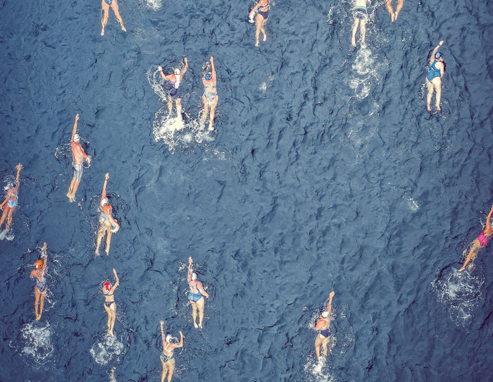 Persons swimming in the lake