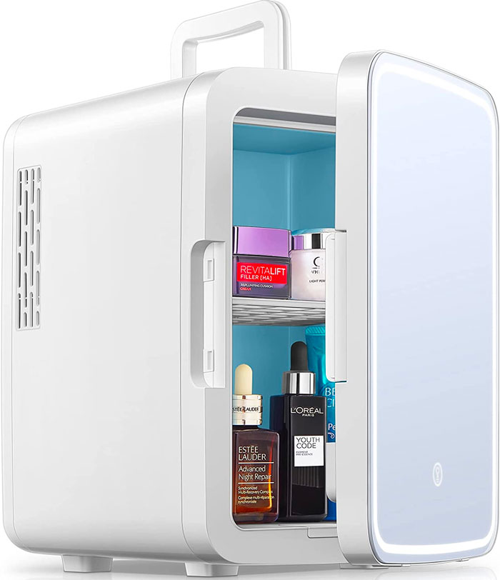 an opened mini skincare fridge