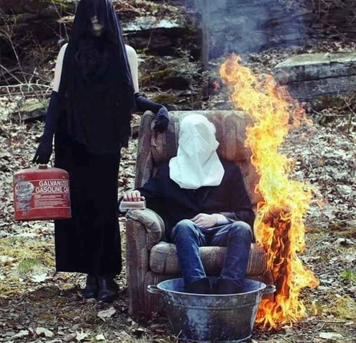 Cursed picture of woman setting person on fire