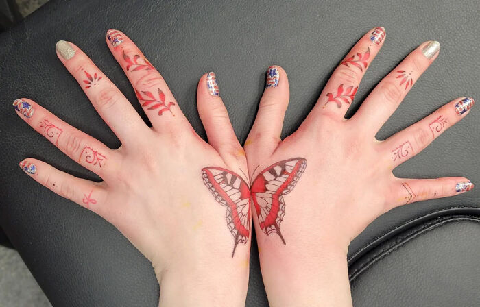Butterfly wings on hands tattoo