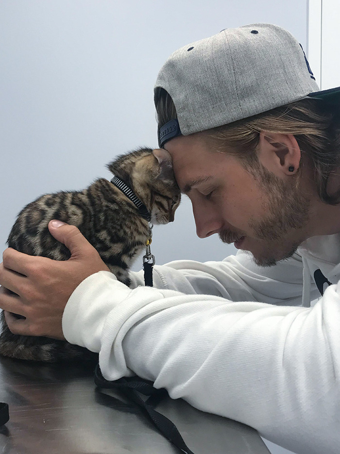 My Husband Comforting Our Kitten At The Vet
