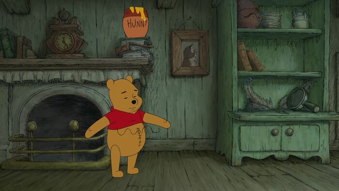 Winnie the Pooh standing in his house