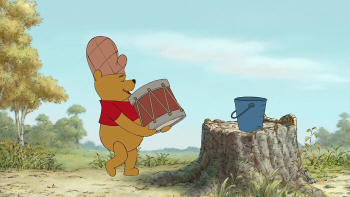 Winnie the Pooh playing drums