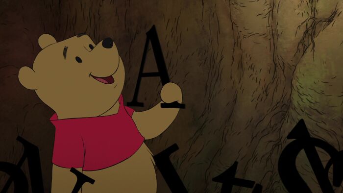 Winnie the Pooh holding letter "A"