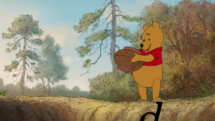 Winnie the Pooh holding a pot of honey