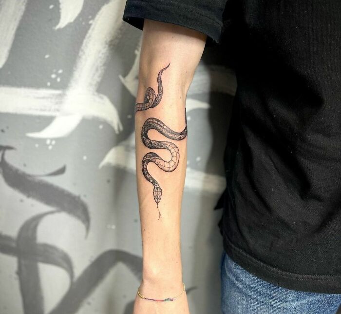 What do solid black armband tattoos symbolize? - Quora