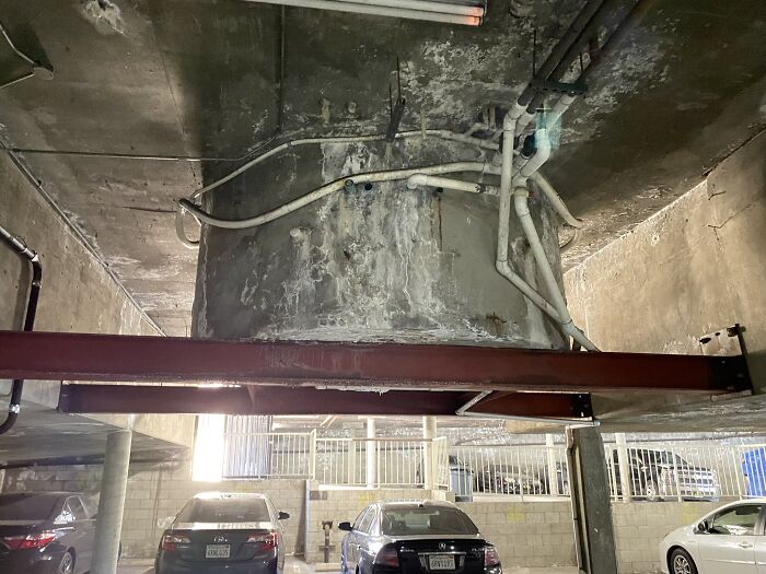 The Spa Built Into The Parking Garage Is Showing Signs Of Distress With Visible Cracks And The Presence Of Efflorescence Indicating Potential Moisture Issues