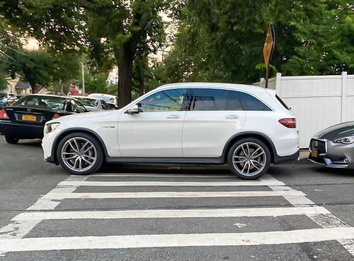 Parking On The Crosswalk And Blocking The Curb Cut