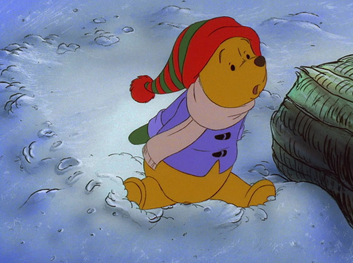 Winnie the Pooh sitting on snow