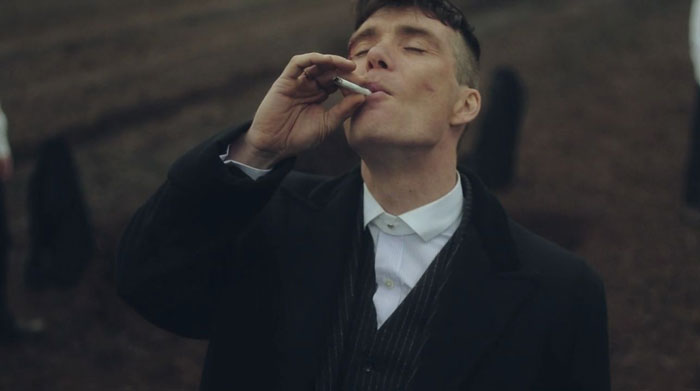 Tommy Shelby smoking a cigarette