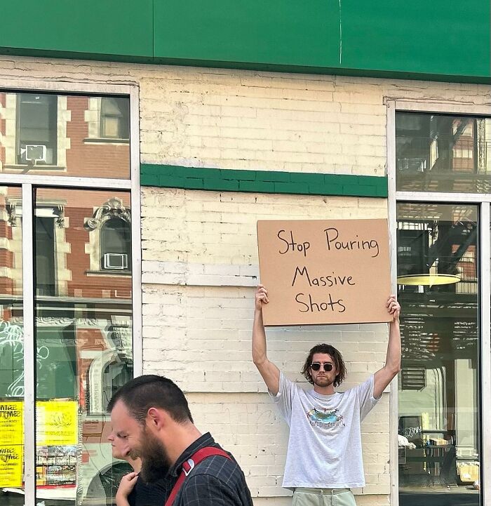 Clever-Dude-With-Sign-Protesting-Annoying-Things