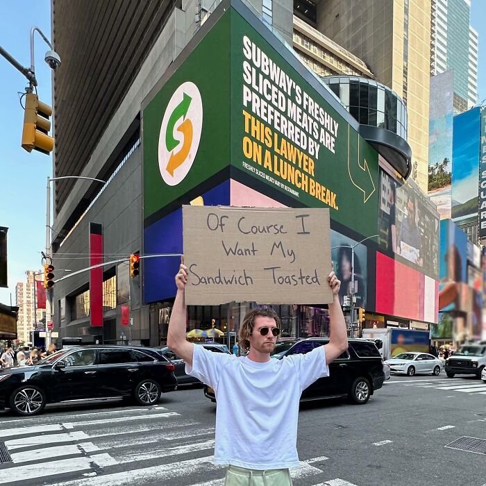 Clever-Dude-With-Sign-Protesting-Annoying-Things