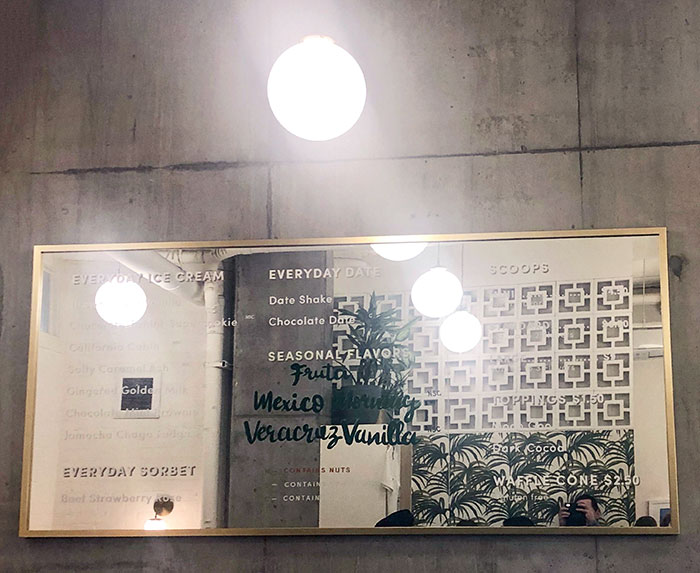 This Busy Ice Cream Shop In Seattle Put Their Menu On A Mirror So It's Impossible To Read