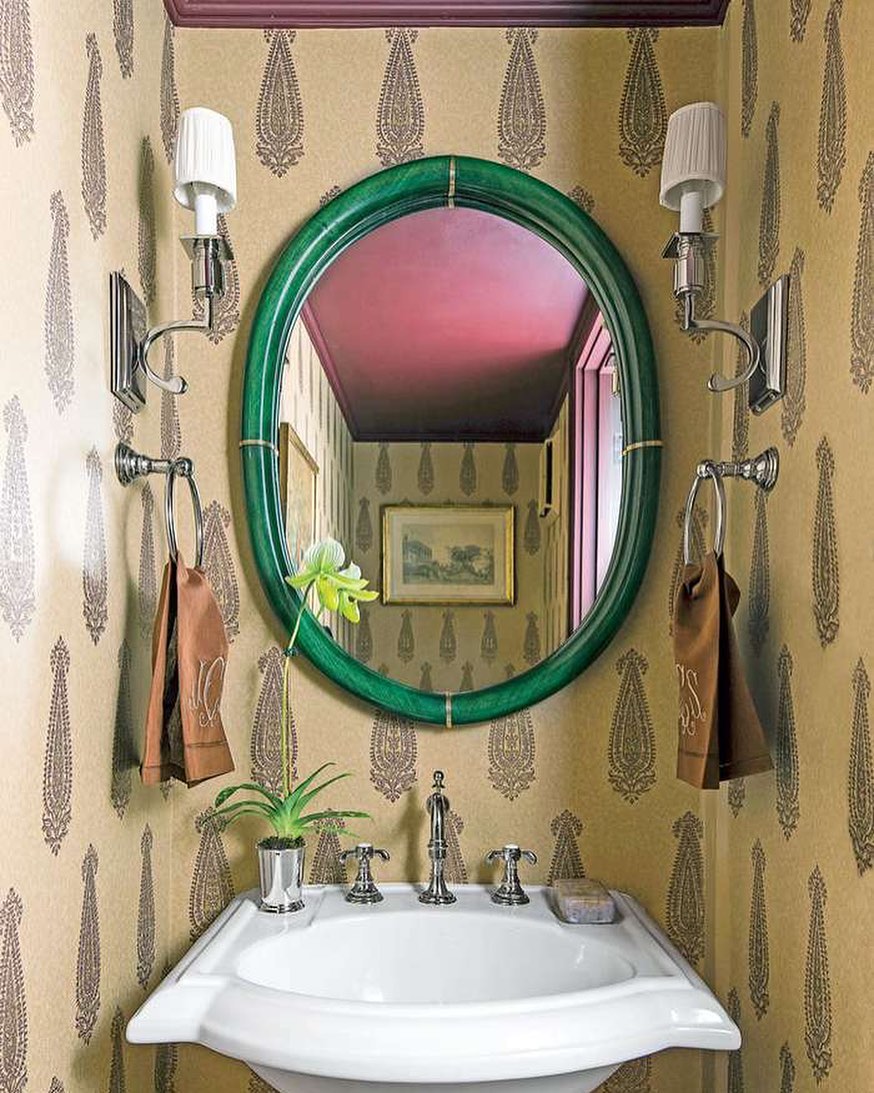 Bathroom with brown wallpaper and sink