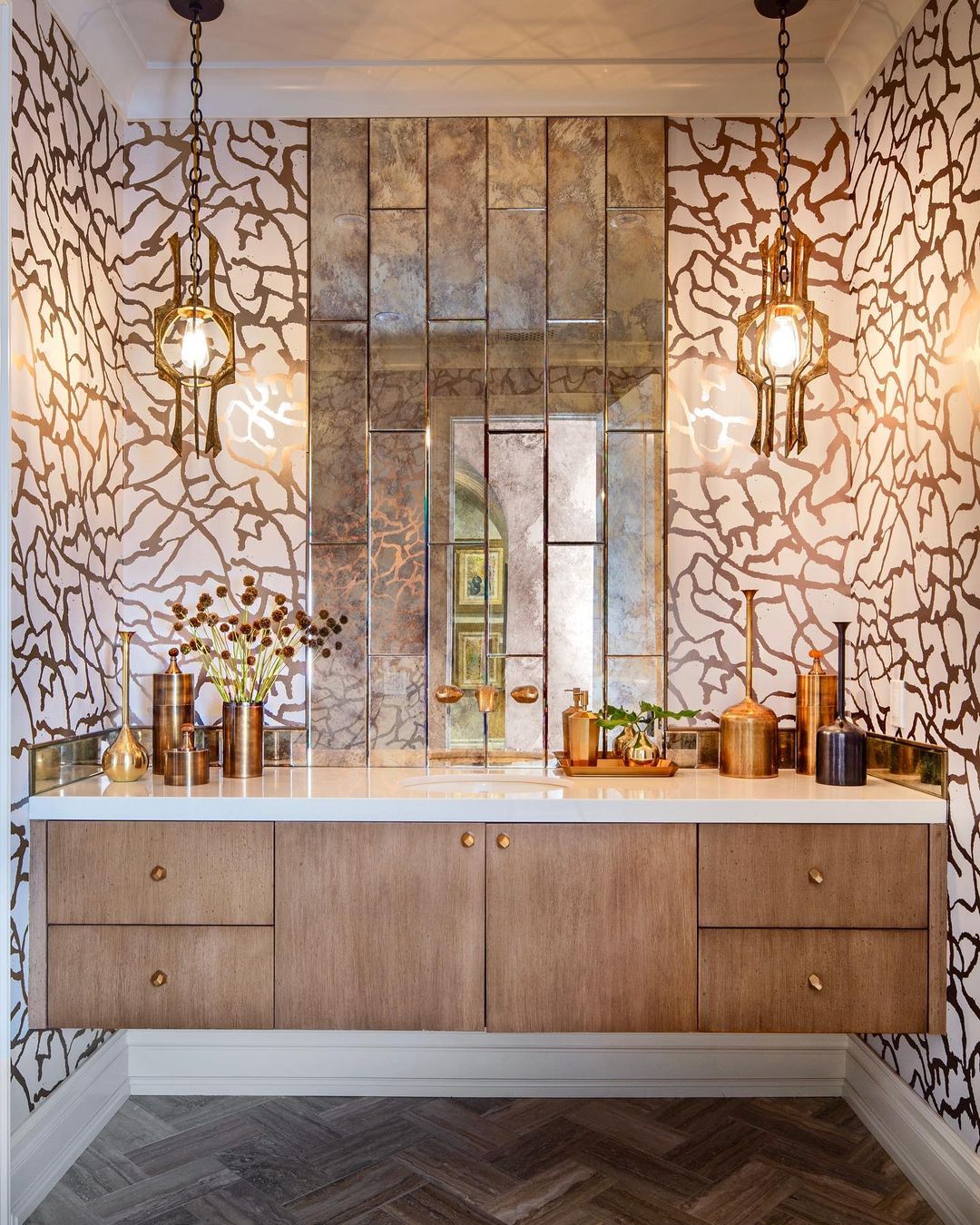 Bathroom with gold striped wallpaper and cupboard with sink