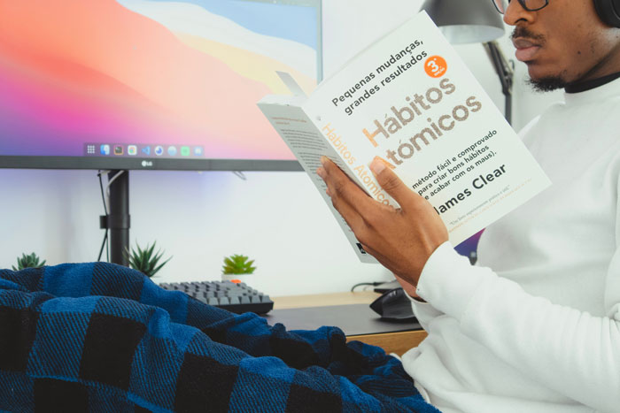 person holding the book in his hand