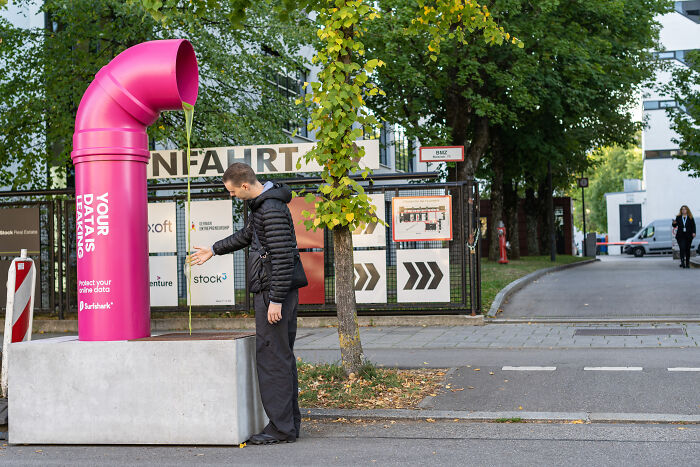 Leaking Pipe Stunt Challenges Big Tech On The Streets Of Munich