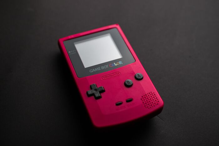 Close-up Photo of Red Game Boy Console