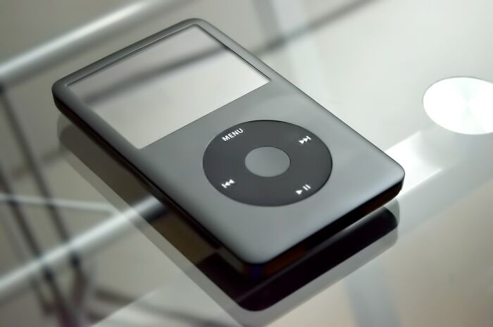 iPod on a glass desk 