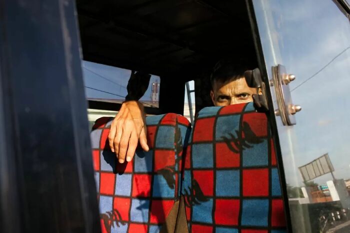 A Photograph Of Man In A Bus