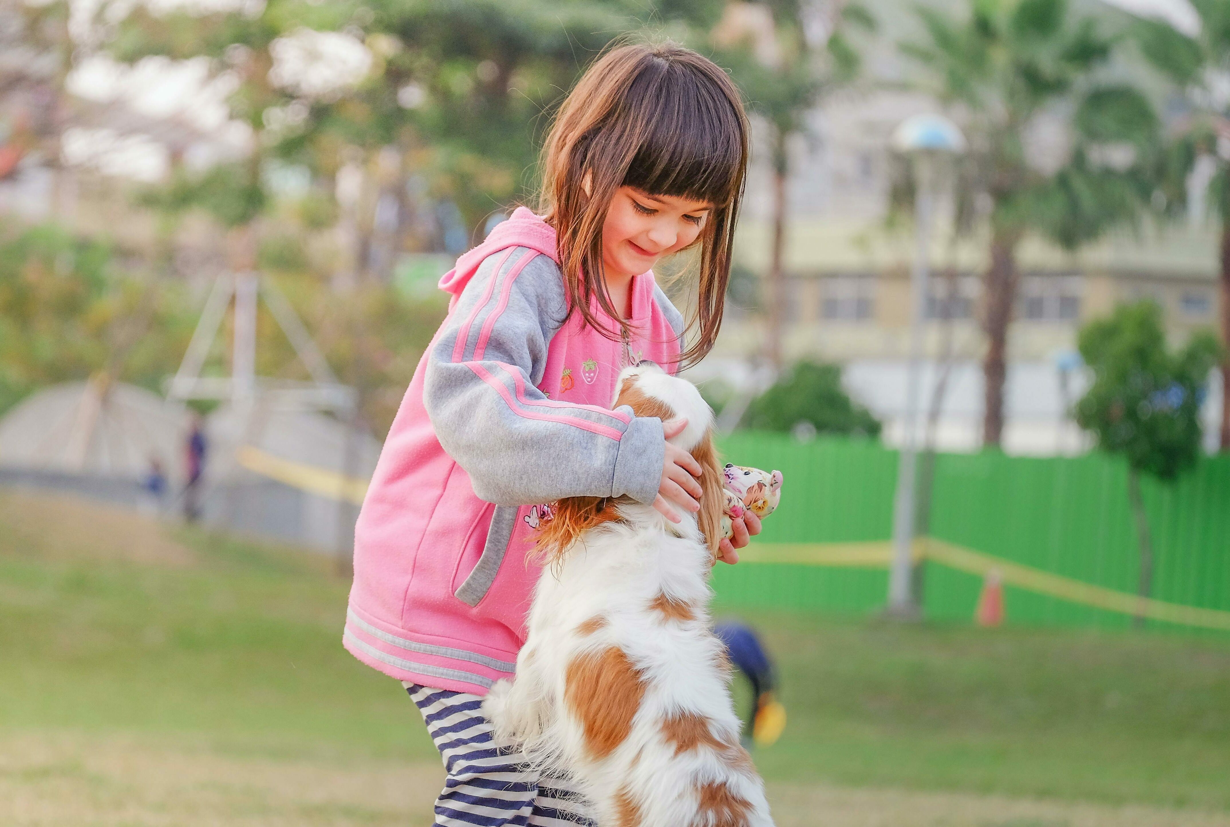 Girl hugging dog