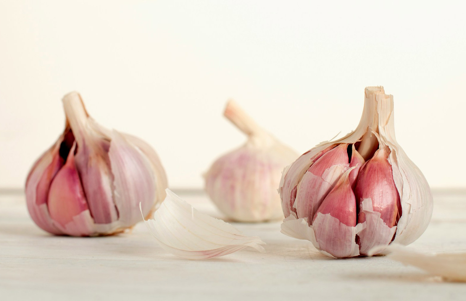 Three garlics on table
