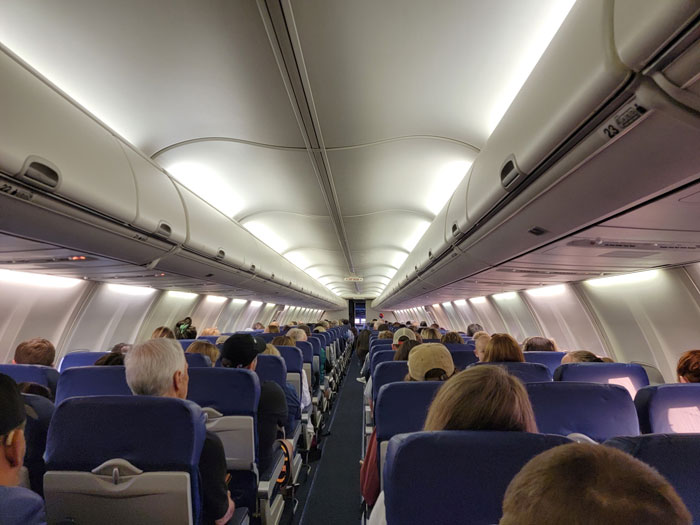 Woman Shares How Small Talk On A Plane Turned Into Unhinged Drama For Everyone To Hear
