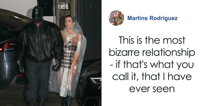 Bianca Censori Photographed Trying To Cover Herself In See-Through Raincoat Beside Masked Kanye