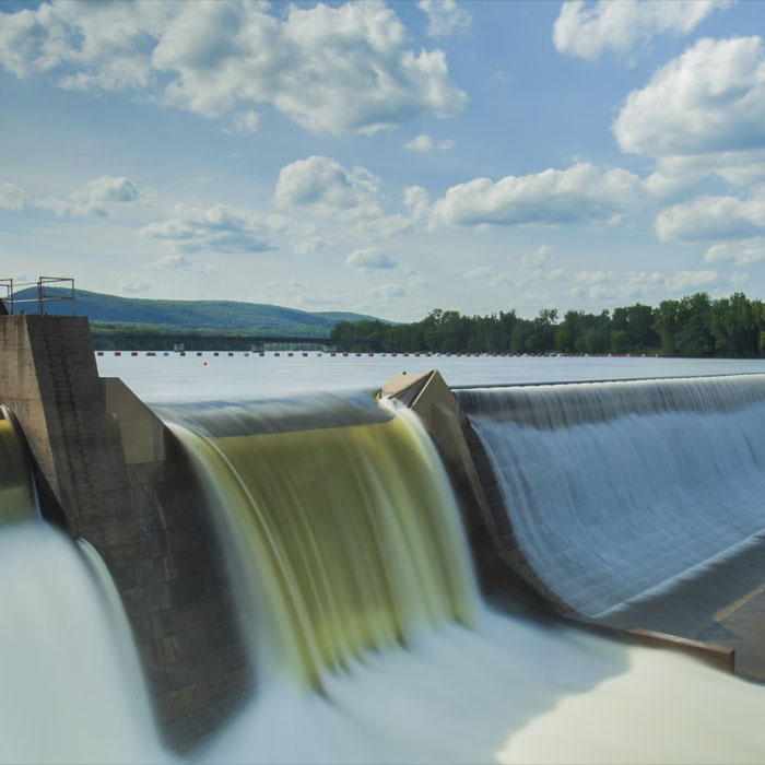 Hydropower and sky with clouds