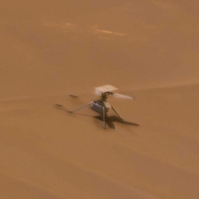 A small drone submerged in beige liquid, implying an expensive mishap.