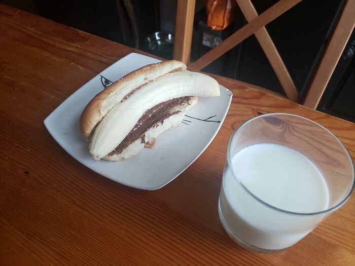 My 5yo Son Is A Genius. This Is What He Wanted For Breakfast: Banana On A Hot Dog Bun With Nutella And Peanut Butter. Side Of Milk