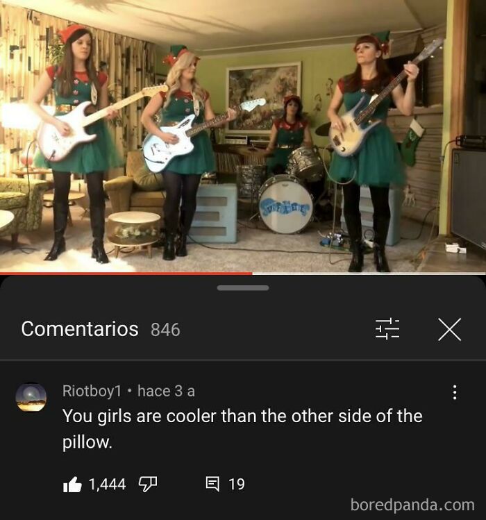 Band performing in a room with Christmas outfits, with a comment saying, &ldquo;You girls are cooler than the other side of the pillow.&quot;