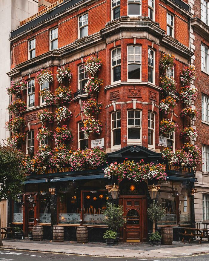 Recently Reopened 1899 Corner Pub Adorned With Flower Baskets, Marylebone, West End Of London, UK