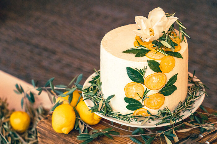 [homemade] I've Never Baked A Cake Before But My Friends Asked Me To For Their Wedding Lol. Lemon Ginger Wedding Cake / Blueberry Compote Filling / Vanilla Bean Buttercream / Candied Lemons