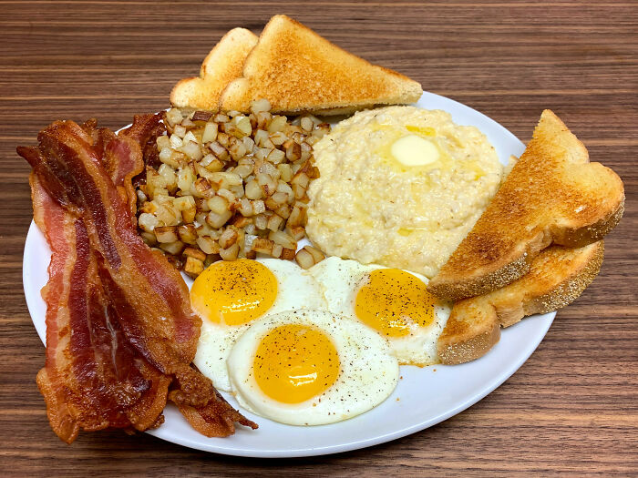 Bacon And Eggs With Country Fried Potatoes, Cheese Grits And Toast