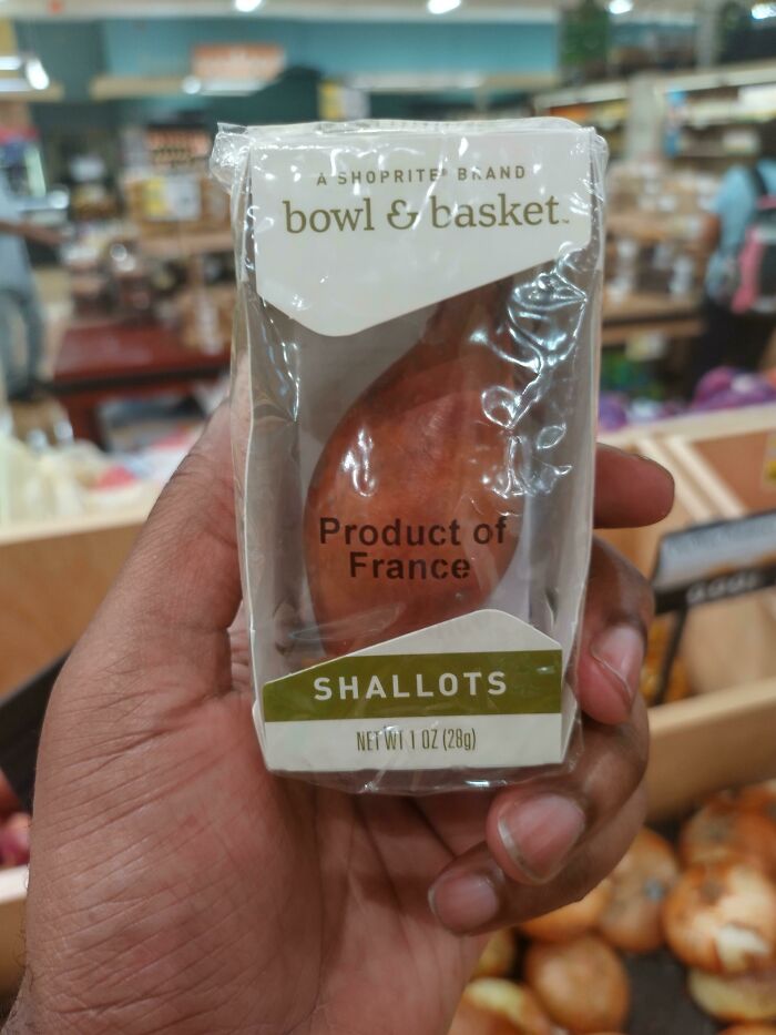 Wrong product packaging showing a single wrapped shallot in a store, labeled "Product of France."