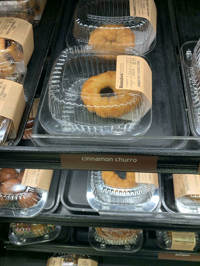 Incorrect churro packaging with donuts inside a plastic container.