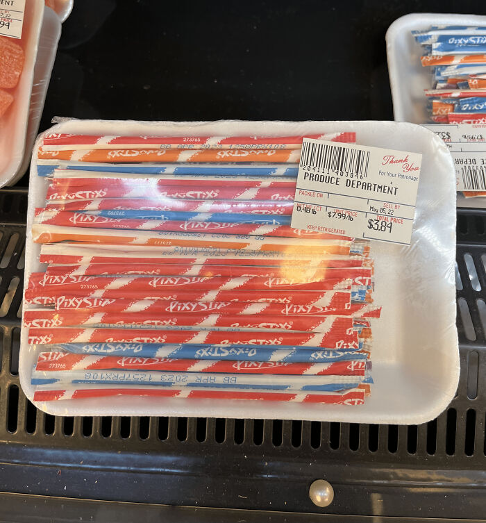 Pixy Stix candy packaged in a styrofoam tray labeled from the Produce Department, showcasing wrong product packaging.