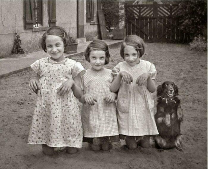 Three Young Girls And A Dog Pose For The Camera. 1930