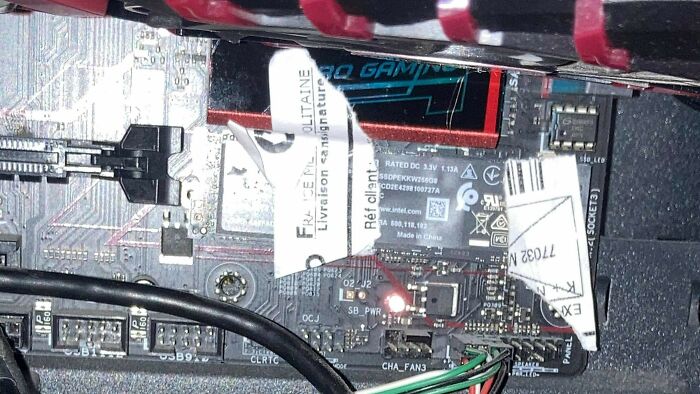 My Friend Doesn't Have M.2 Screws, So He Used The Sticker From A Package To Hold His Nvme Drive In His Computer