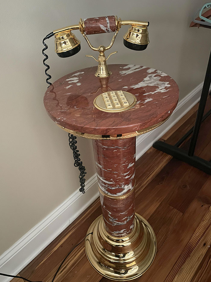 The Side Table In Our Airbnb Is A Non-Functioning Phone