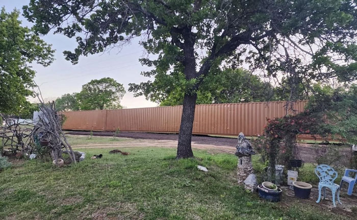 Folks Praise Woman Who Made A Whole Fence Of Shipping Containers To Ruin Entitled Neighbors' View