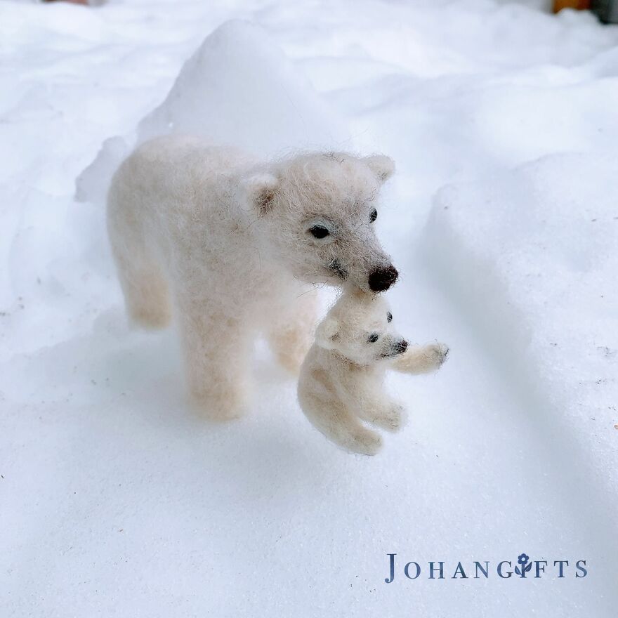 Polar Bear And Playful Cub