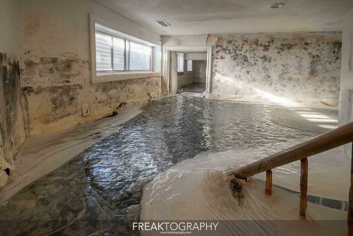 A Flooded And Frozen Basement In An Abandoned Mansion