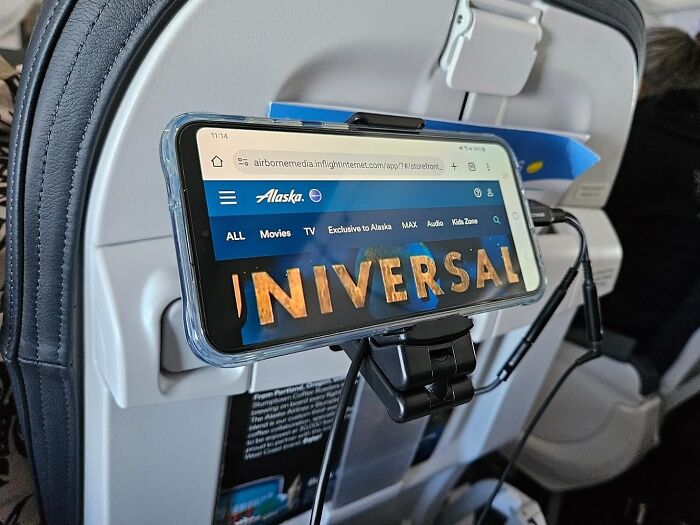 This In-Flight Phone Mount Will Ensure That You Can Binge-Watch Your Favorite Show On Your Next Trans-Atlantic 