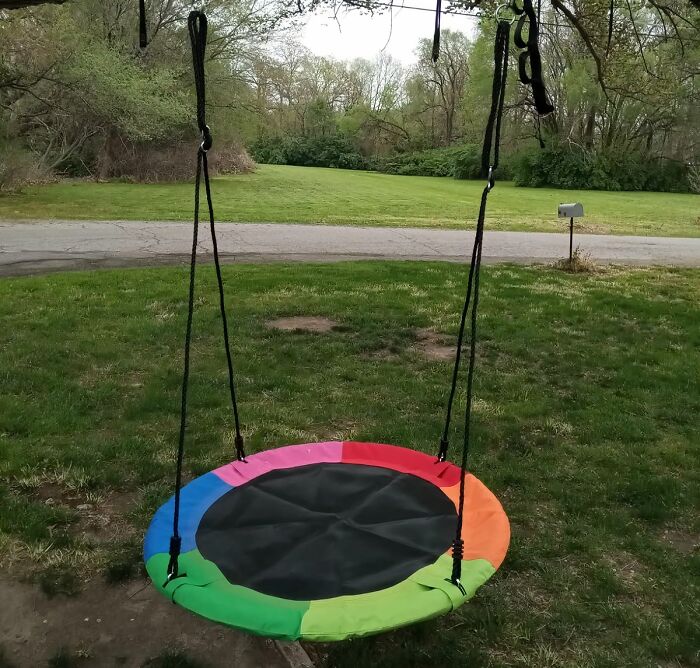 Add A Pop Of Color To Your Outdoor Area With This Rainbow Disc Swing 