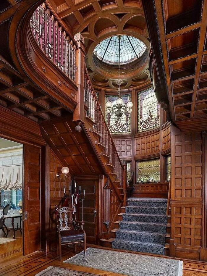 Grand Staircase With Intricate Woodwork And Wall Panelling In A Restored 1893 Queen Anne Victorian Mansion, Plainfield, Union County, New Jersey