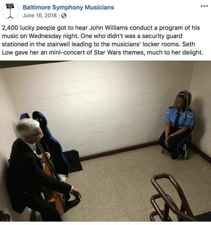 Musician playing cello for delighted security guard, highlighting wholesome internet moments.