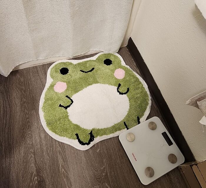 This Cute Bath Mat Makes Us Wonder What It Is Smiling About So Much...