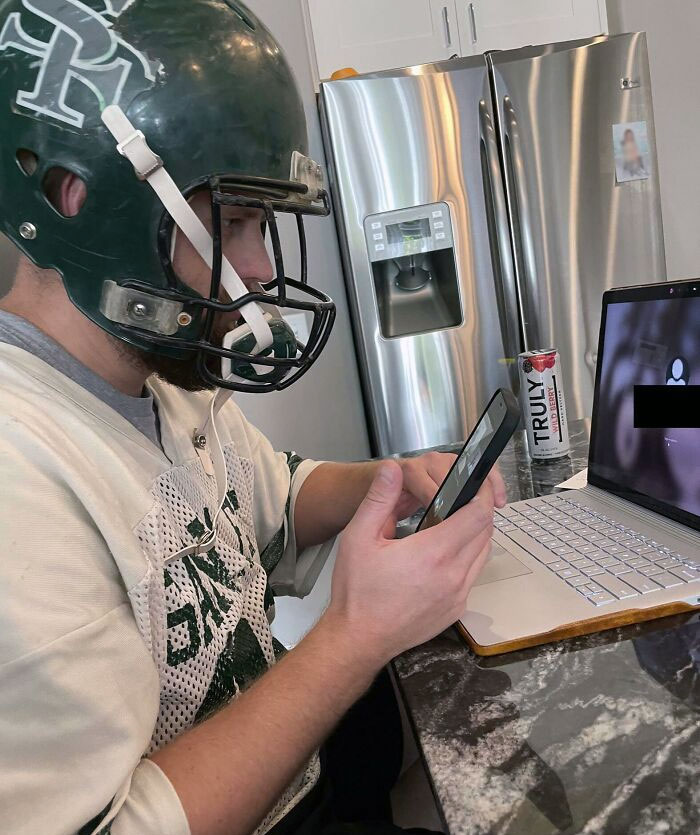 My Brother-In-Law Doing His Fantasy Football Draft In His HS Football Uniform (And Helmet). He’s 33